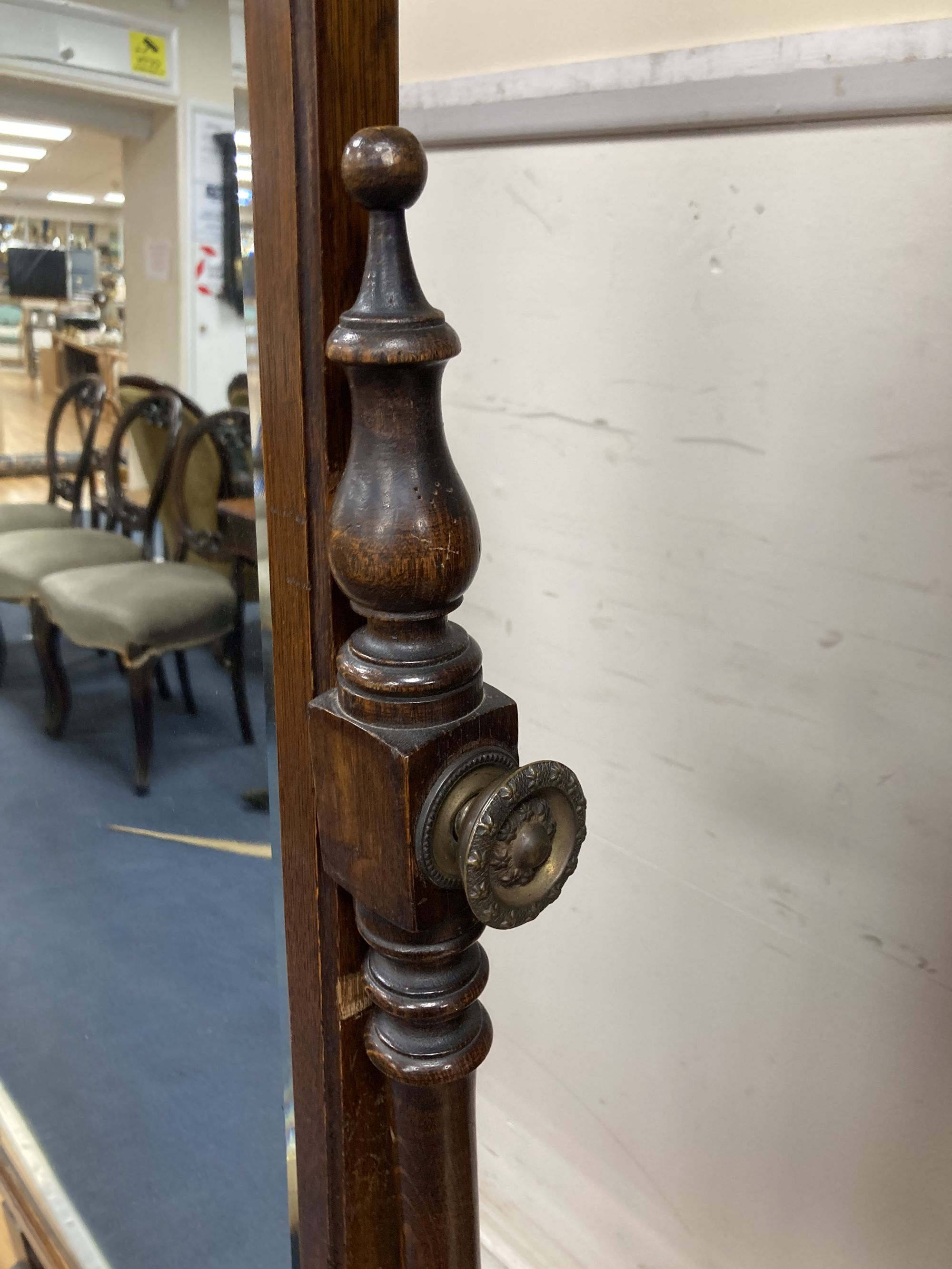 A 1920s oak cheval mirror, width 68cm height 164cm